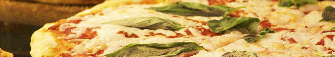Eating Italian Pizza at Primo Pasta Kitchen restaurant in Pasadena, MD.